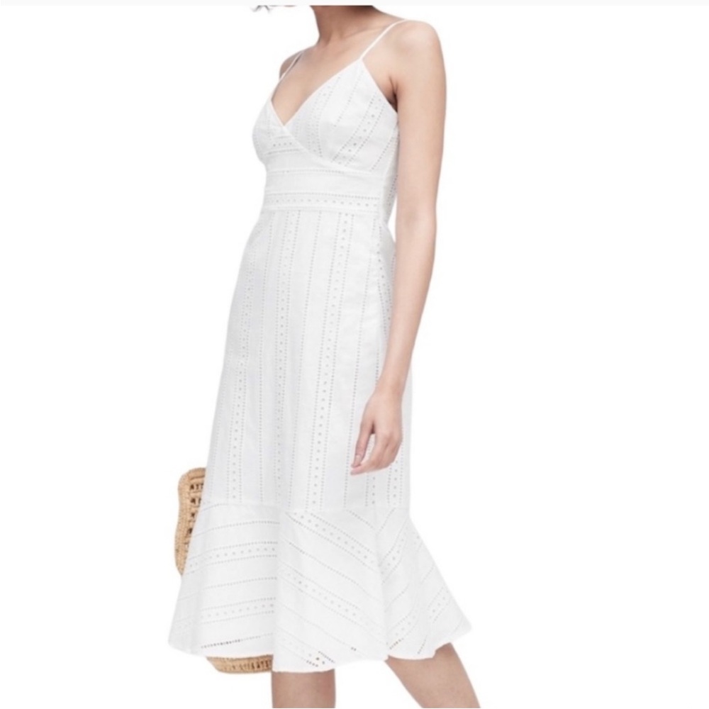 Banana Republic white eyelet dress with ruffle hem. Spaghetti strap with v neck